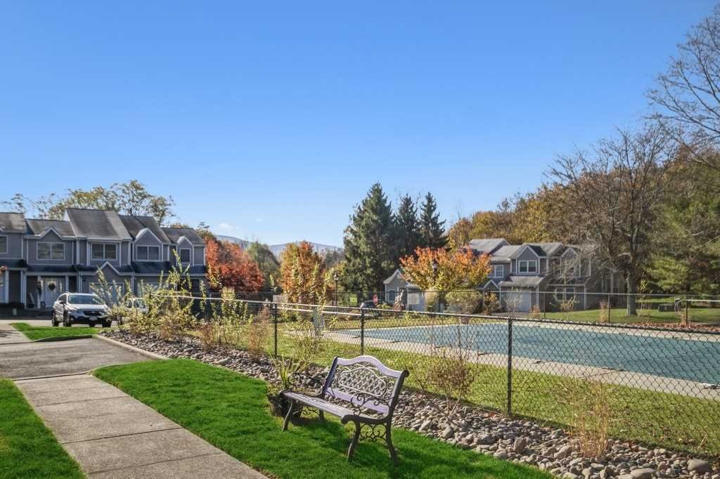 39 Deer Crossing Drive Fishkill, NY 12524 - Photo 33 of 35 a view of a lake with a house in the background