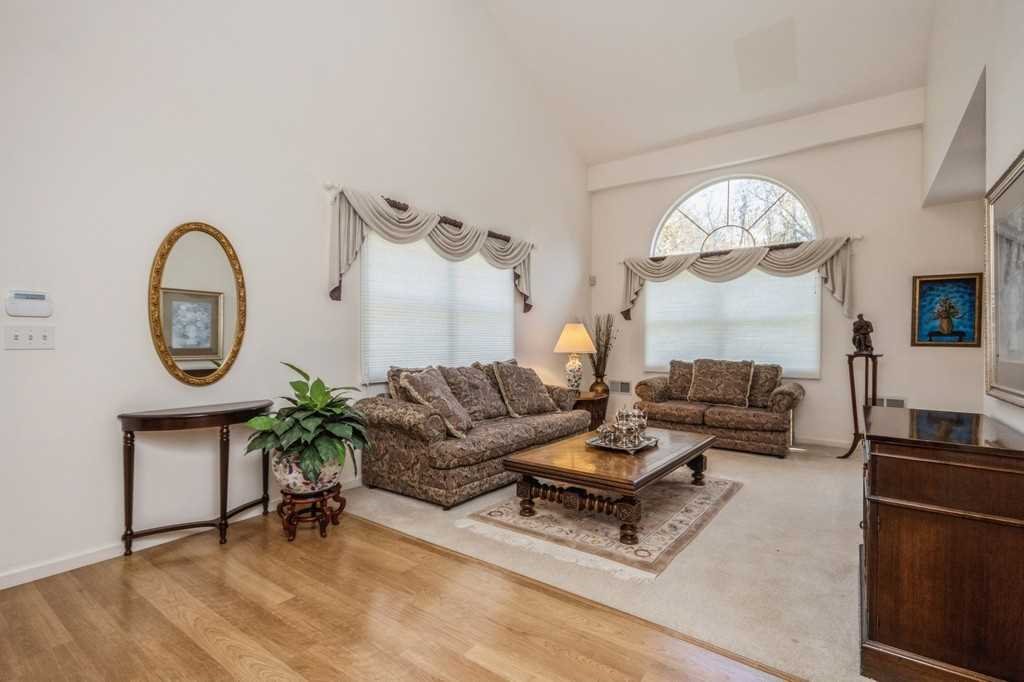 39 Deer Crossing Drive Fishkill, NY 12524 - Photo 5 of 35 a living room with furniture a large mirror and a fireplace