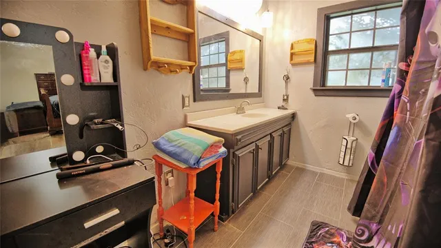 a view of walk in closet with clothes