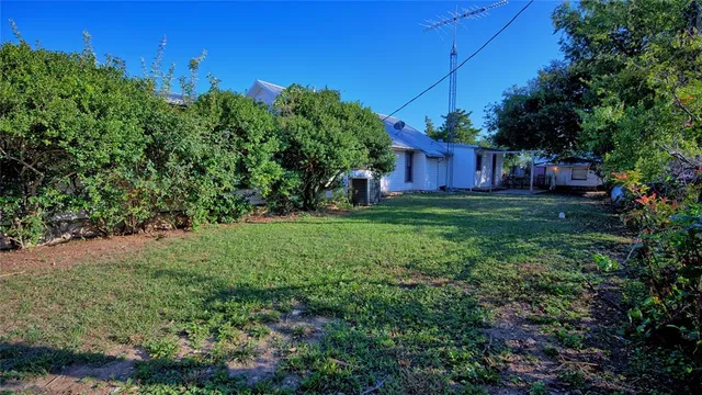 a view of a back yard of a house