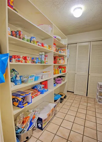 a bedroom with furniture and a wooden floor