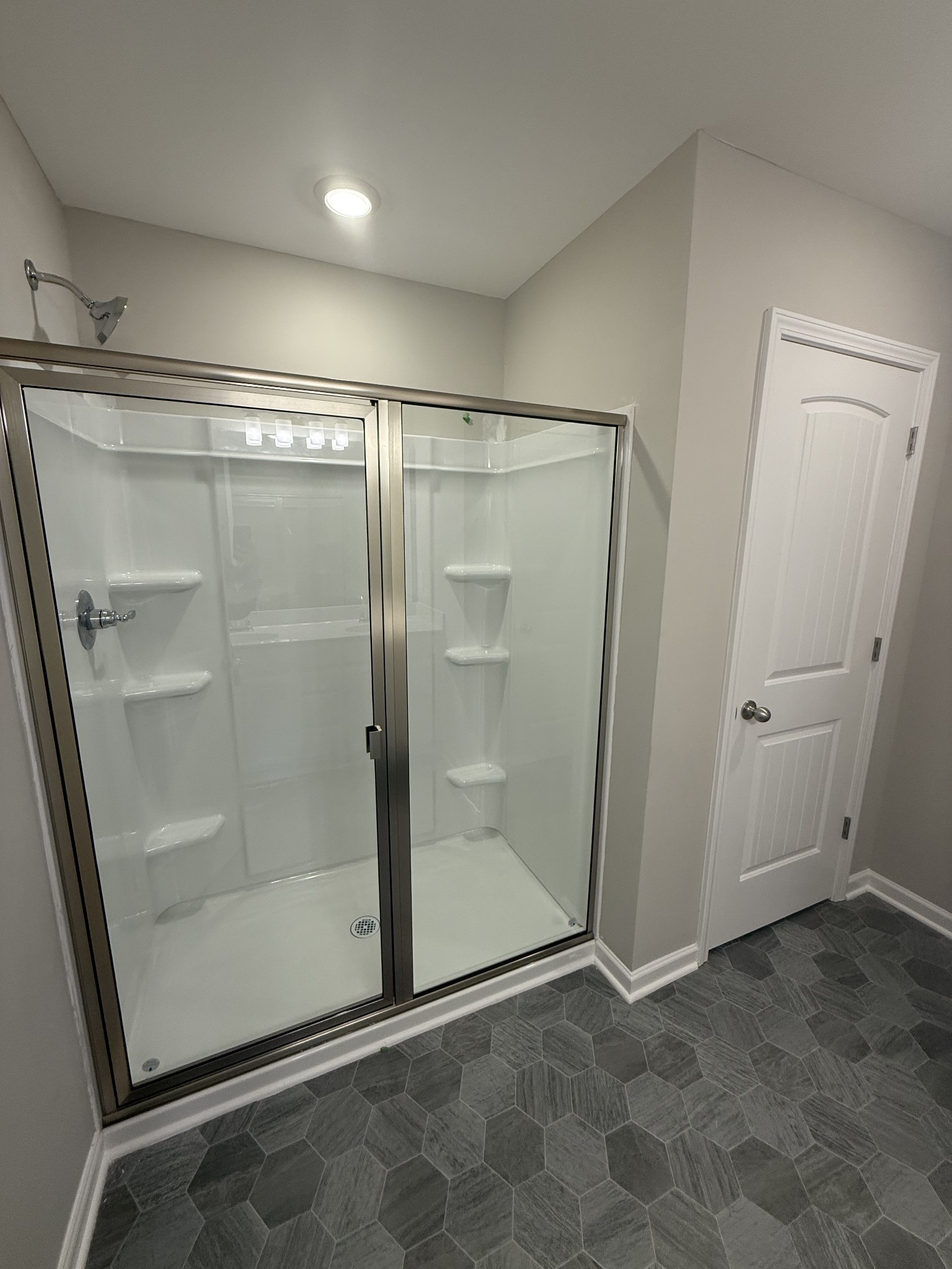 258 Selesia Lane Pleasant View, TN 37146 - Photo 13 of 17 a bathroom with a glass shower door