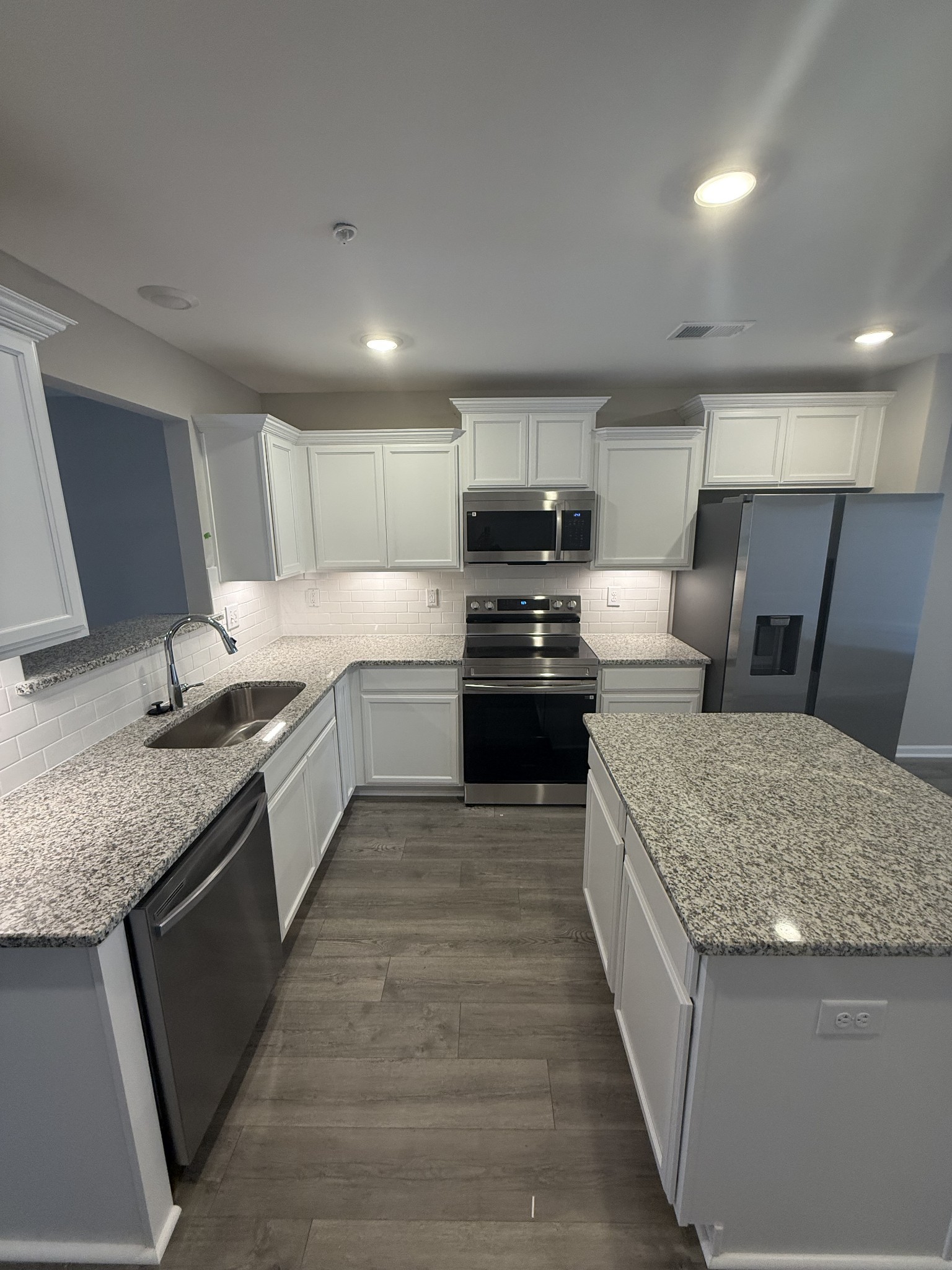 258 Selesia Lane Pleasant View, TN 37146 - Photo 4 of 17 a kitchen with stainless steel appliances granite countertop a sink stove and refrigerator