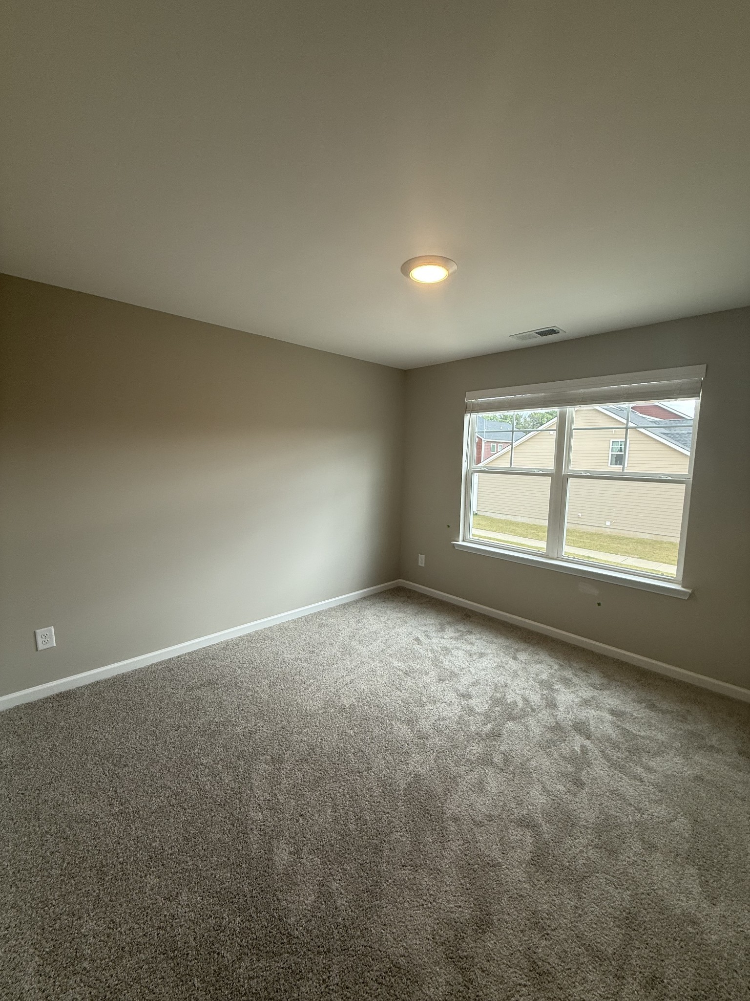258 Selesia Lane Pleasant View, TN 37146 - Photo 9 of 17 an empty room with windows