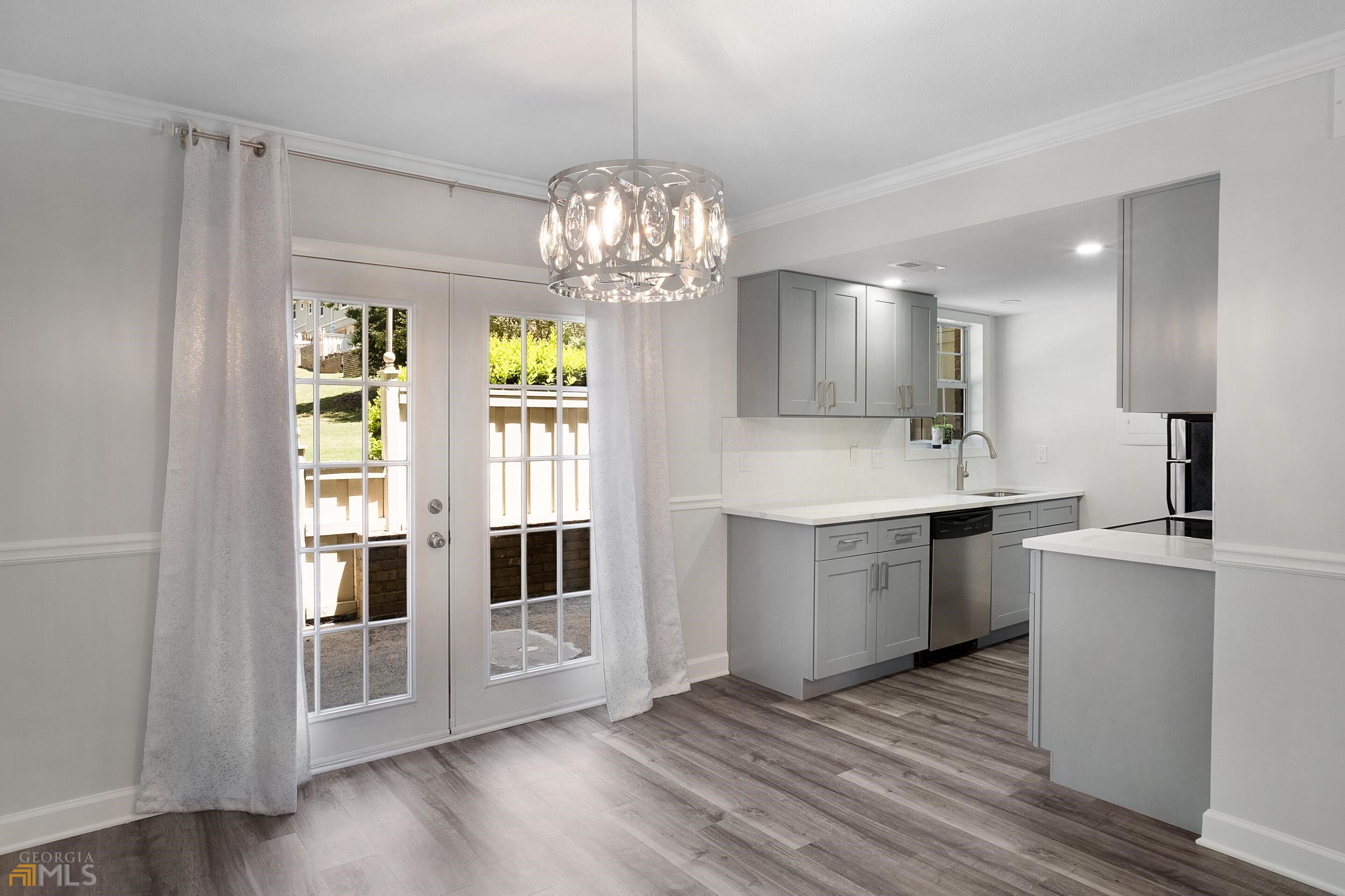 6900 Northeast Roswell Road, Unit F2 Sandy Springs, GA 30328 - Photo 1 of 1 a kitchen with stainless steel appliances granite countertop a stove and a sink