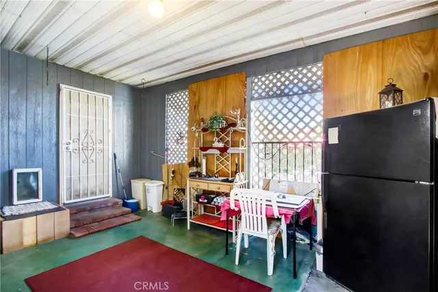 a view of a livingroom with furniture and a fireplace
