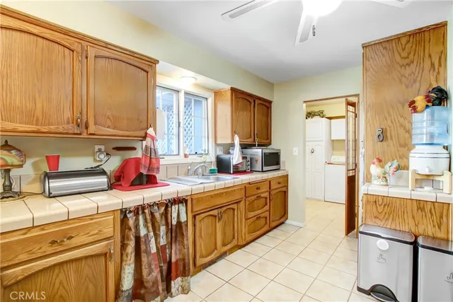 a kitchen with stainless steel appliances granite countertop a sink and cabinets