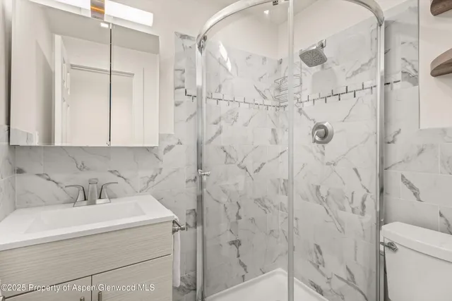 a bathroom with a sink and shower