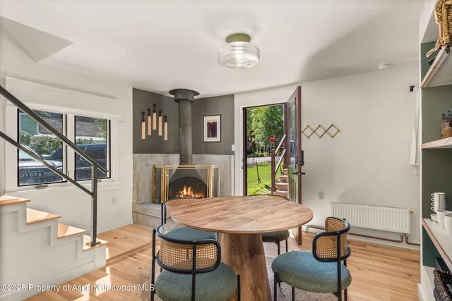 a view of a dining room with furniture window and wooden floor