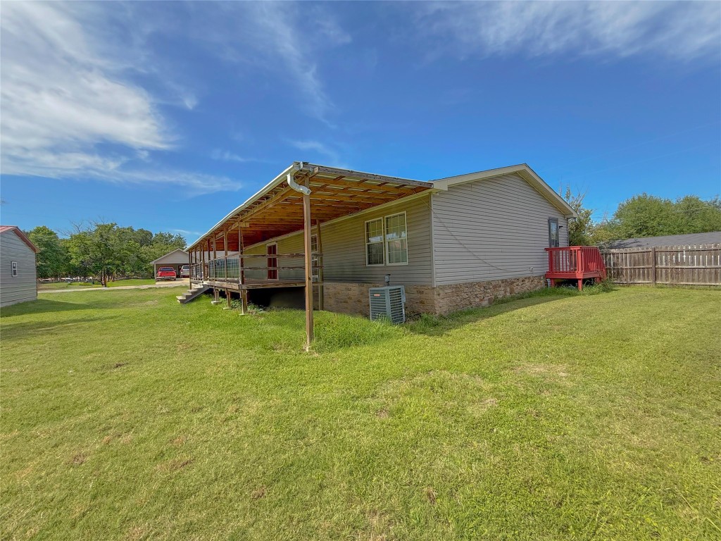 845 Caldwell Street Lexington, TX 78947 - Photo 23 of 39 View of home's exterior featuring central air condition unit