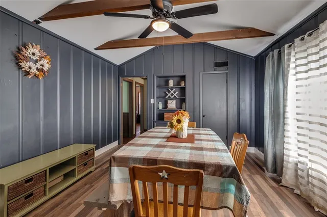 a very nice looking dining room with a table and chairs