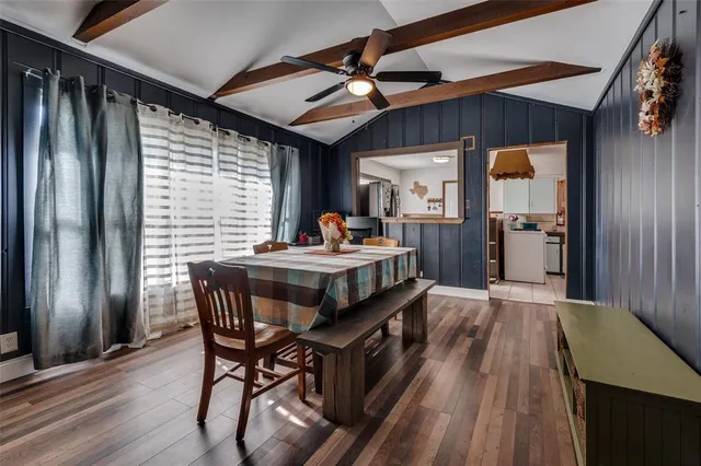 a dining room with furniture and window