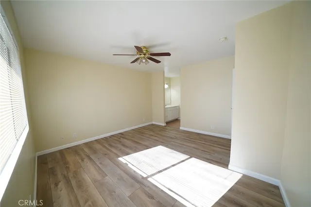 a view of an empty room and a window
