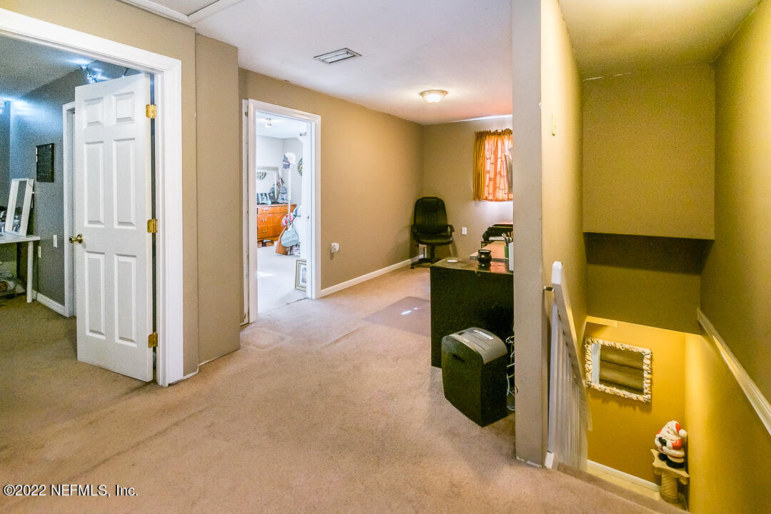 635 Jasmine Street Atlantic Beach, FL 32233 - Photo 13 of 20 a en suite bathroom with a toilet sink and mirror