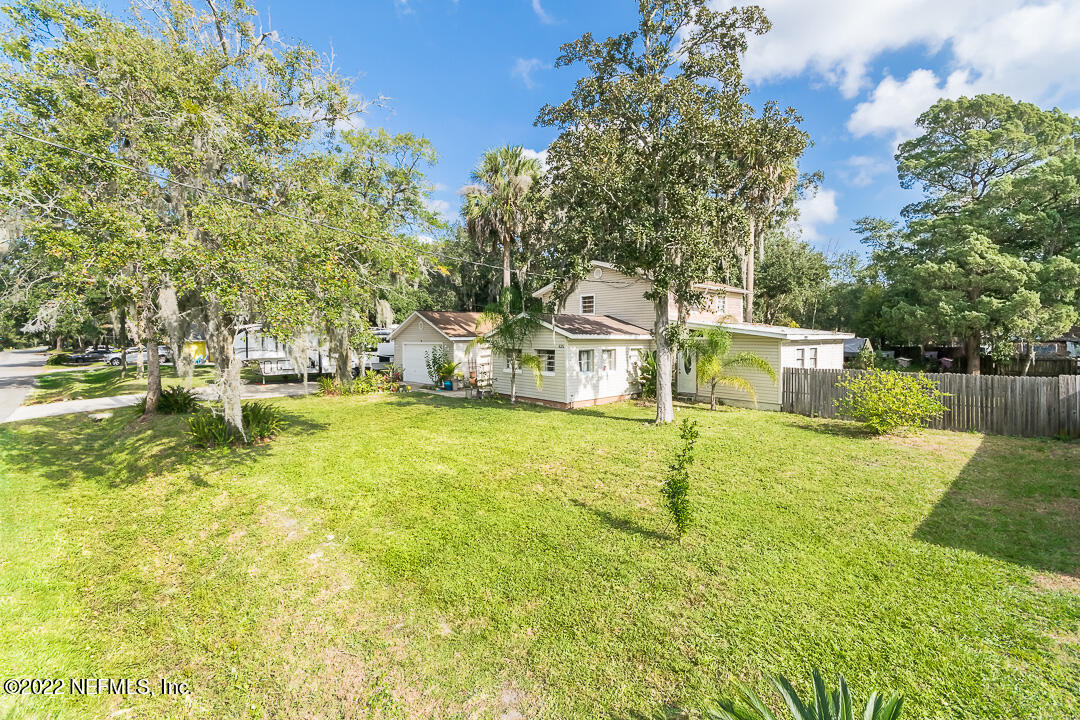 635 Jasmine Street Atlantic Beach, FL 32233 - Photo 2 of 20 a view of a swimming pool with a yard