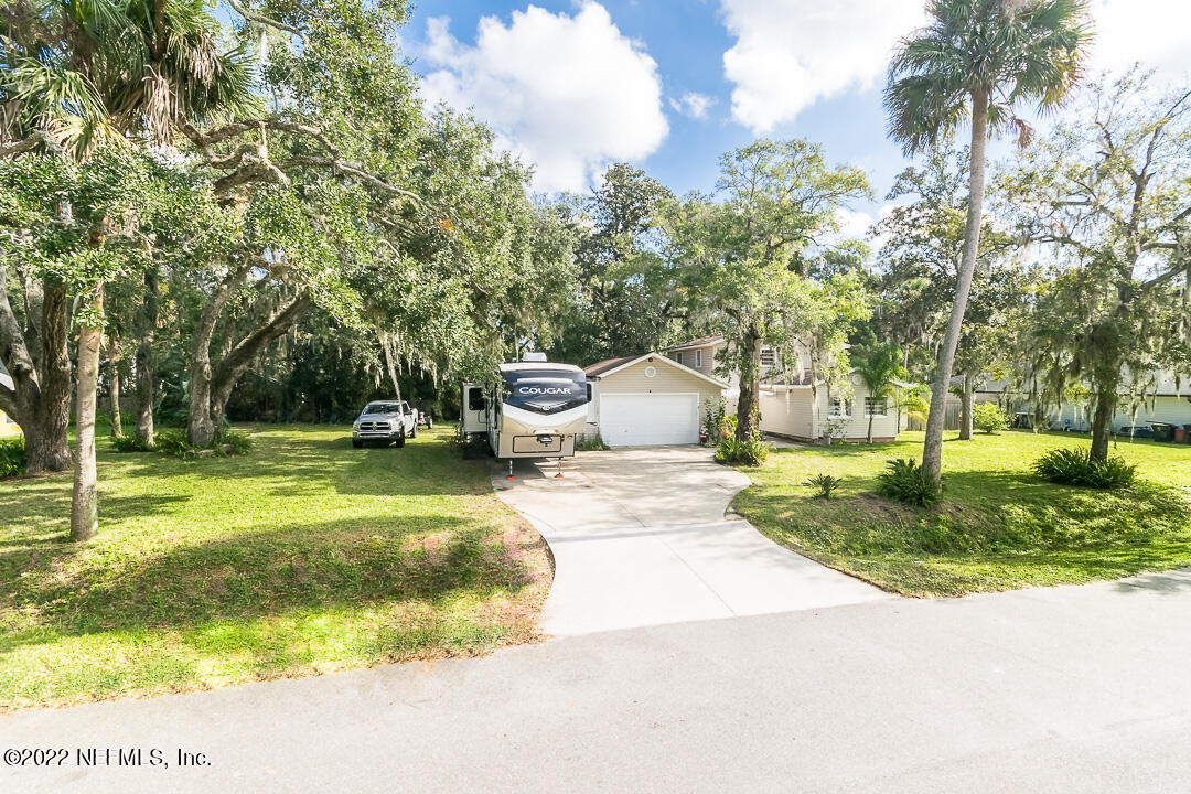 635 Jasmine Street Atlantic Beach, FL 32233 - Photo 3 of 20 a view of a swimming pool with a patio