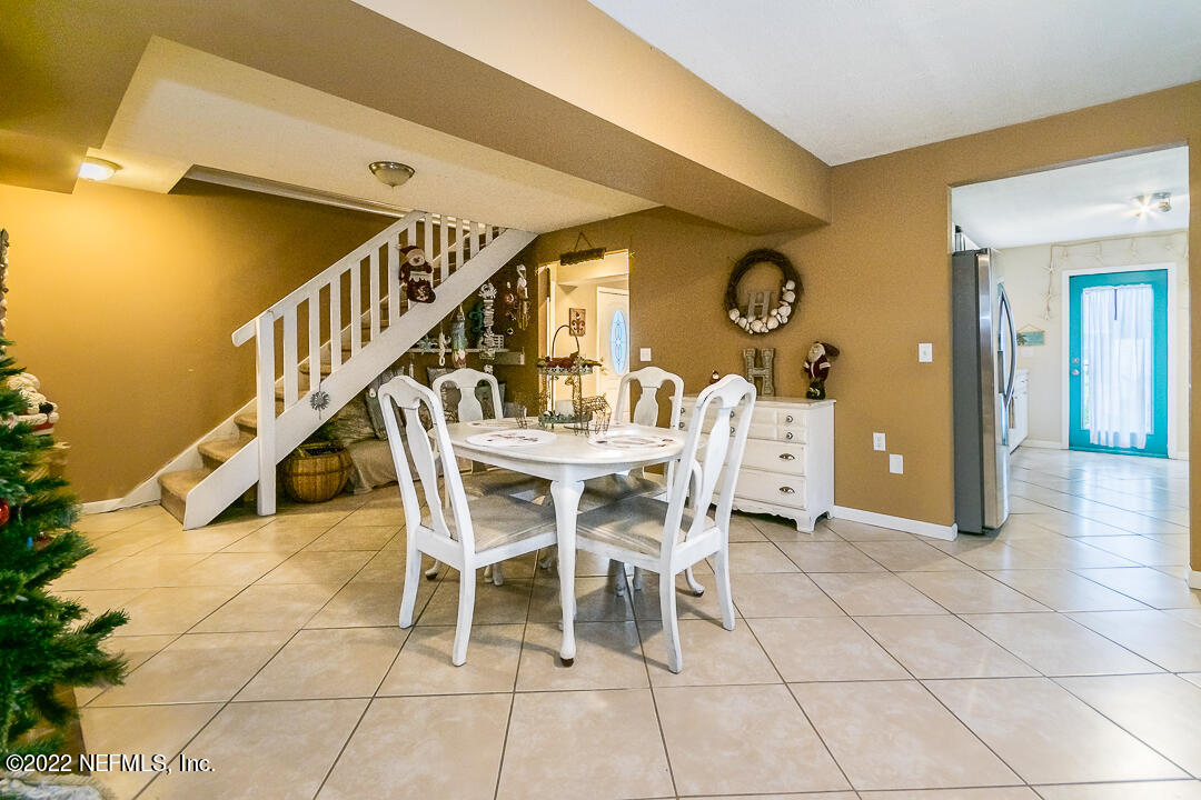 635 Jasmine Street Atlantic Beach, FL 32233 - Photo 7 of 20 a view of a dining room with furniture and a chandelier