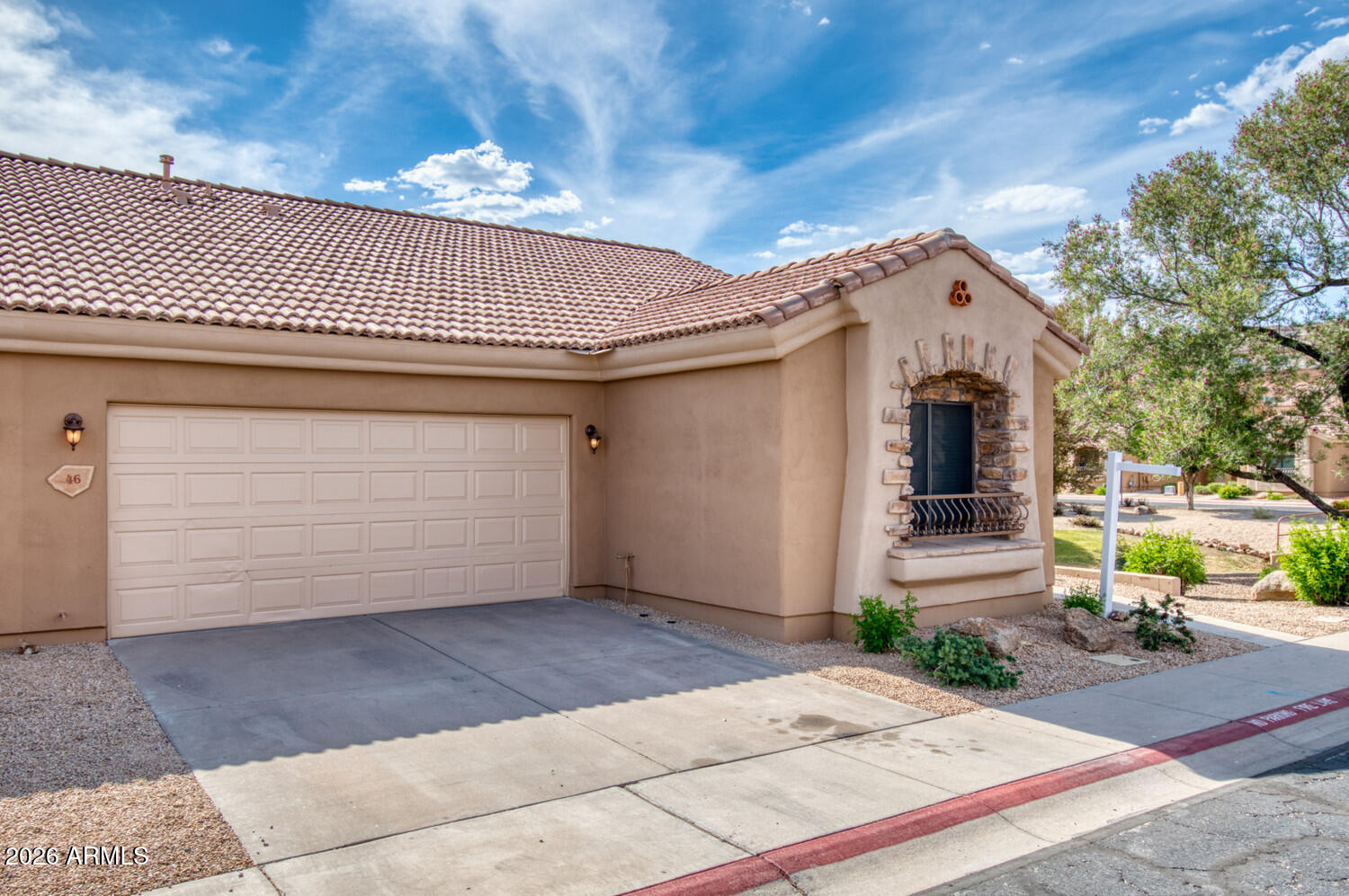 2565 South Signal Butte Road, Unit 46 Mesa, AZ 85209 - Photo 12 of 44 a front view of a house with a garage