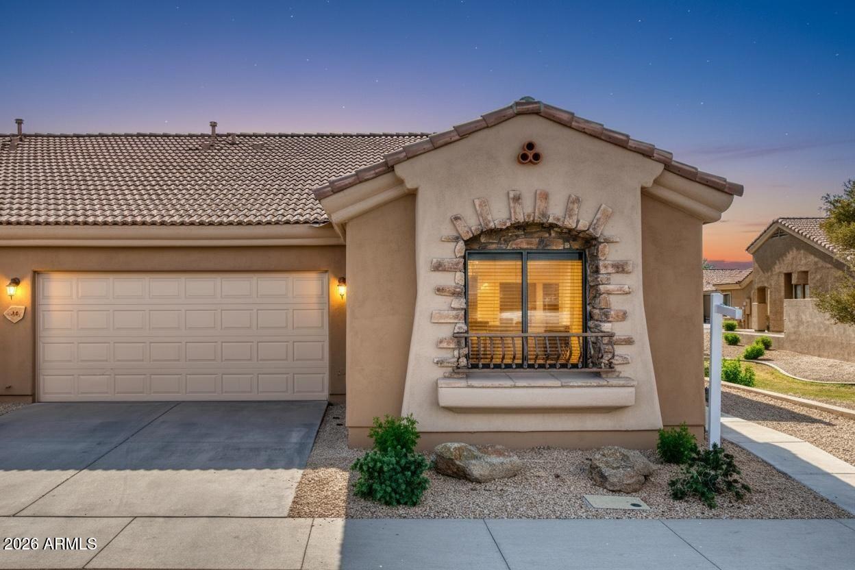 2565 South Signal Butte Road, Unit 46 Mesa, AZ 85209 - Photo 15 of 44 a front view of a house with a yard