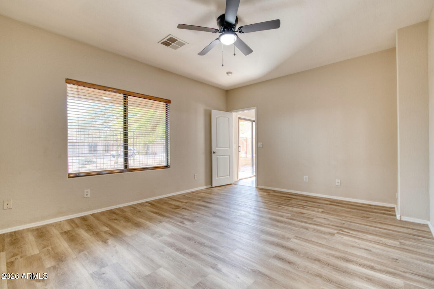 2565 South Signal Butte Road, Unit 46 Mesa, AZ 85209 - Photo 22 of 44 a view of an empty room with a window