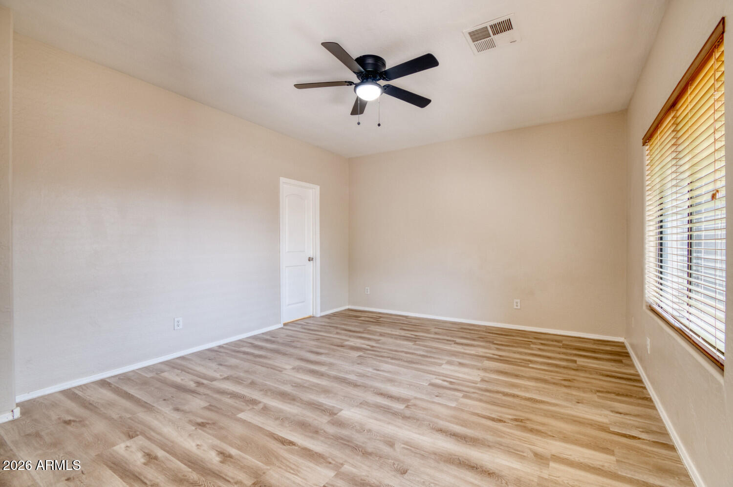 2565 South Signal Butte Road, Unit 46 Mesa, AZ 85209 - Photo 23 of 44 wooden floor in an empty room with a window