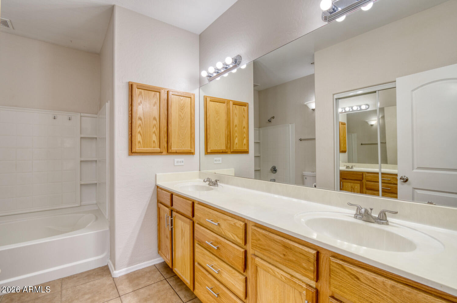 2565 South Signal Butte Road, Unit 46 Mesa, AZ 85209 - Photo 24 of 44 a bathroom with a sink double vanity granite tub shower and a mirror