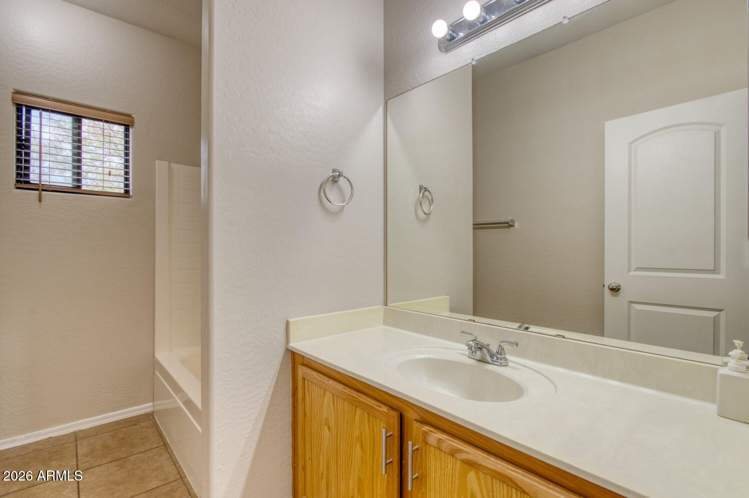 2565 South Signal Butte Road, Unit 46 Mesa, AZ 85209 - Photo 26 of 44 a bathroom with a granite countertop sink and a mirror