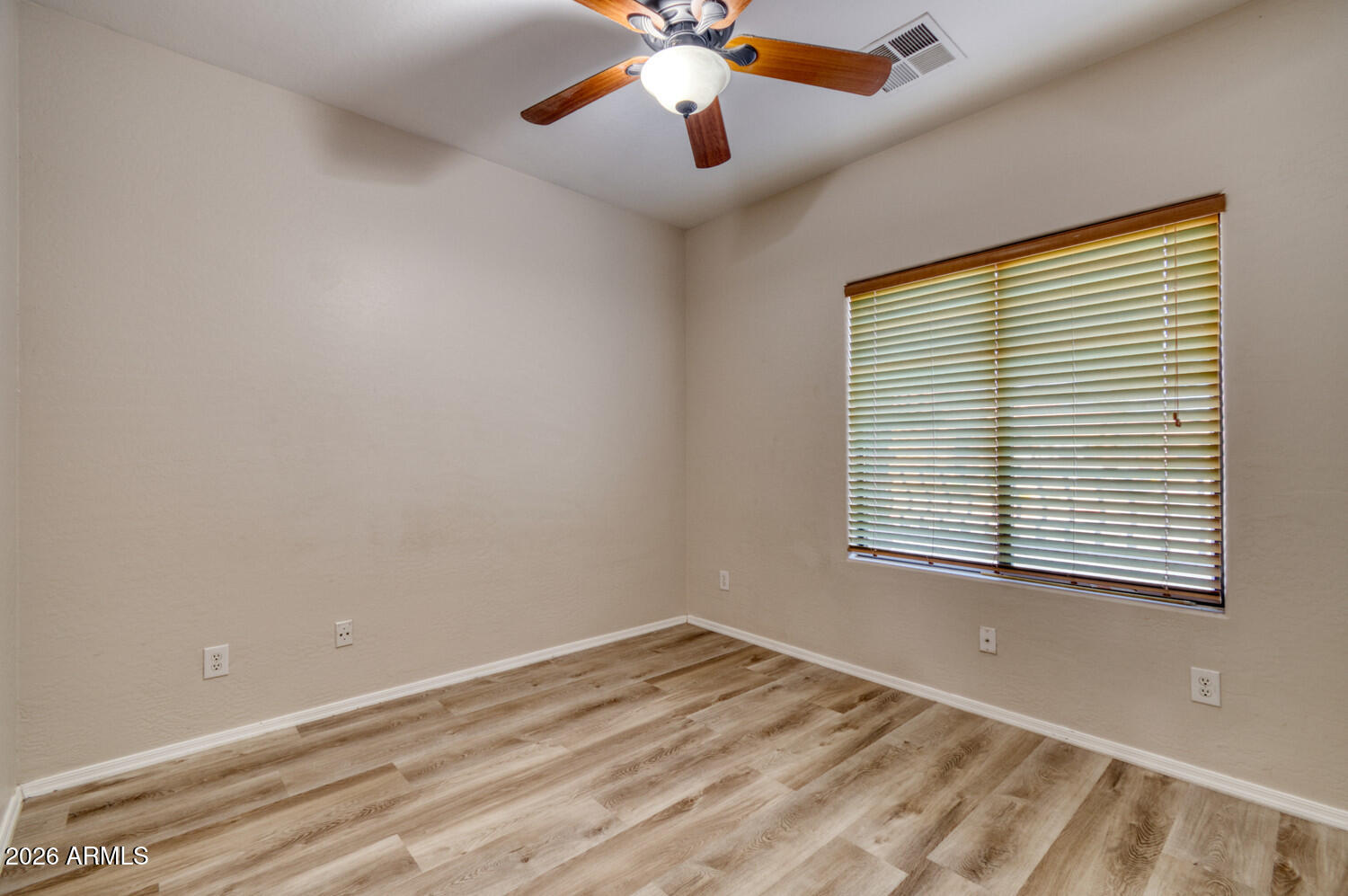 2565 South Signal Butte Road, Unit 46 Mesa, AZ 85209 - Photo 28 of 44 a view of an empty room with a window