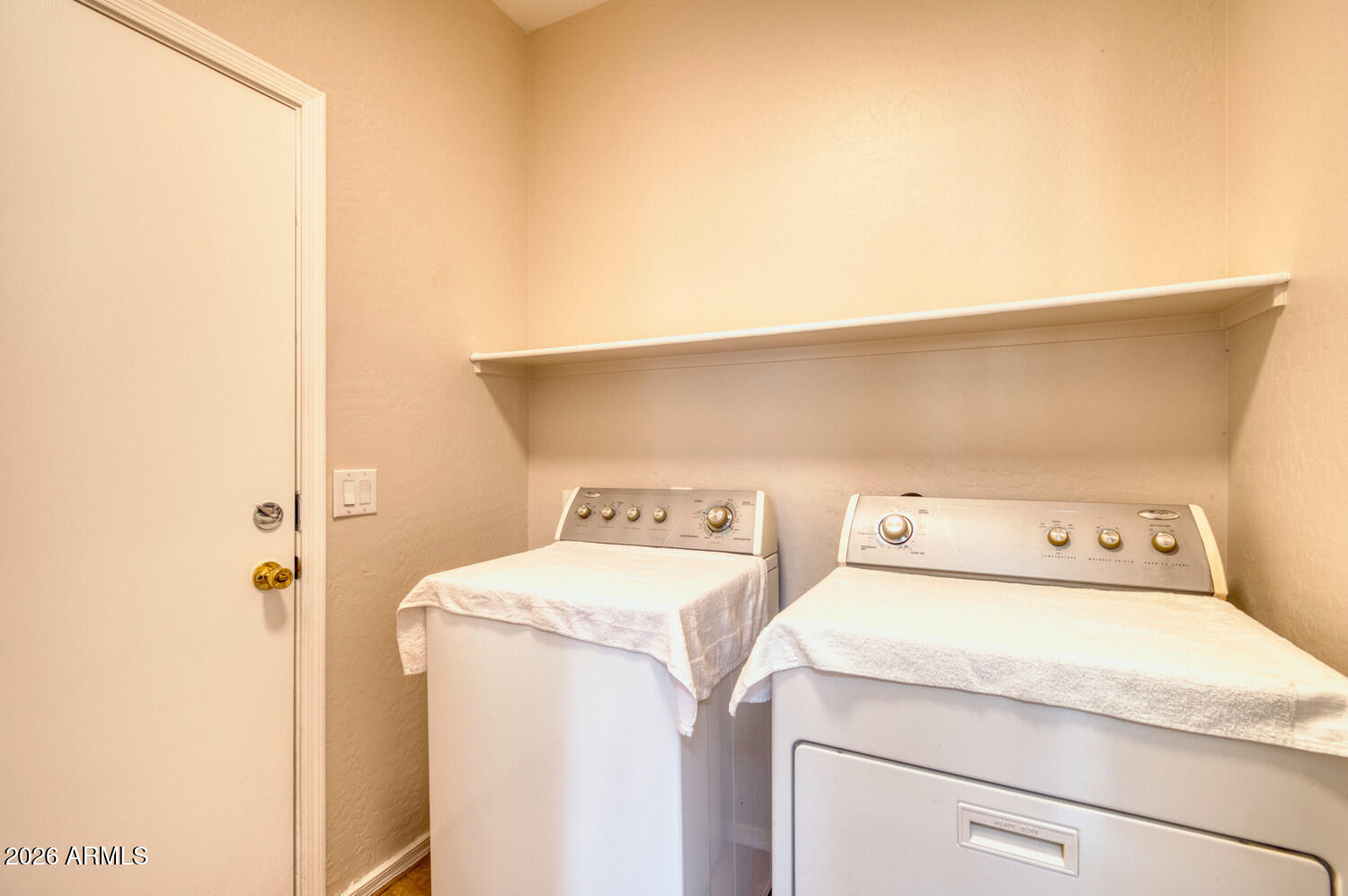 2565 South Signal Butte Road, Unit 46 Mesa, AZ 85209 - Photo 32 of 44 a utility room with dryer and washer
