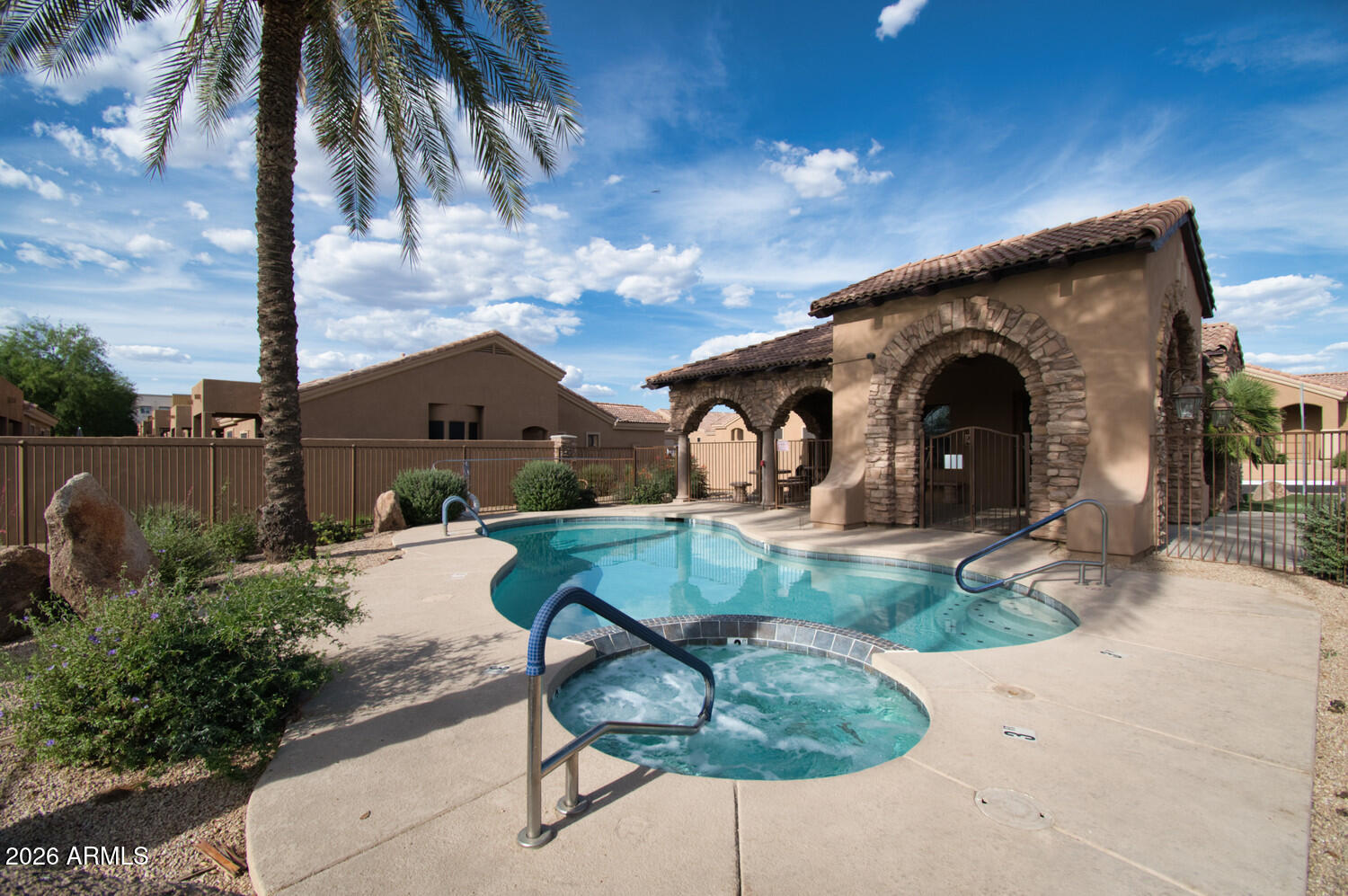 2565 South Signal Butte Road, Unit 46 Mesa, AZ 85209 - Photo 9 of 44 a front view of a house with garden