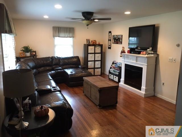 88 Dellwood Road Edison, NJ 08820 - Photo 2 of 16 a living room with furniture and a flat screen tv