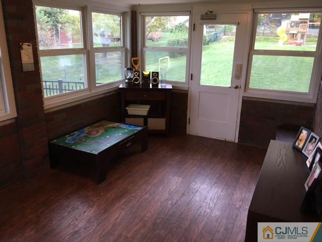 88 Dellwood Road Edison, NJ 08820 - Photo 14 of 16 a living room with furniture and a floor to ceiling window