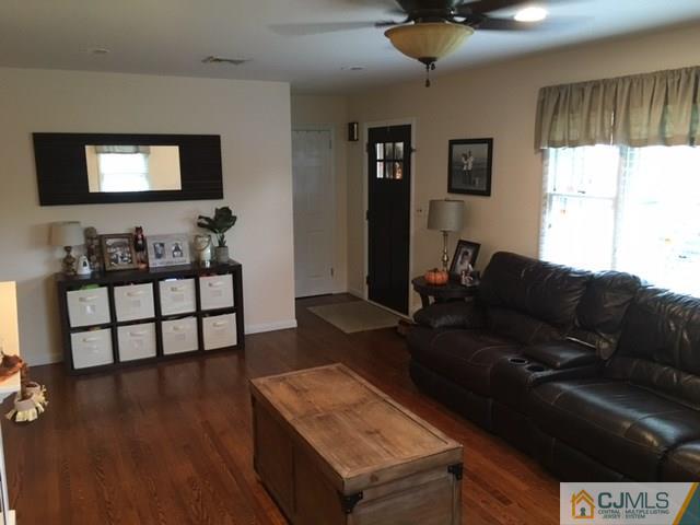 88 Dellwood Road Edison, NJ 08820 - Photo 3 of 16 a living room with furniture and a flat screen tv