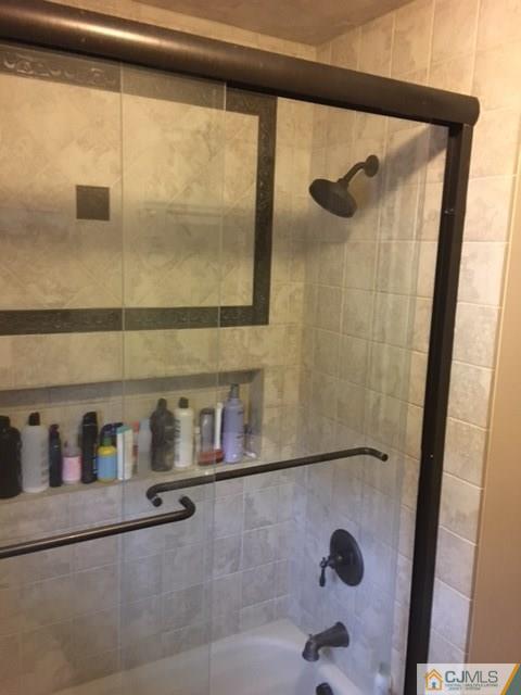 88 Dellwood Road Edison, NJ 08820 - Photo 10 of 16 a bathroom with a tub and a shower