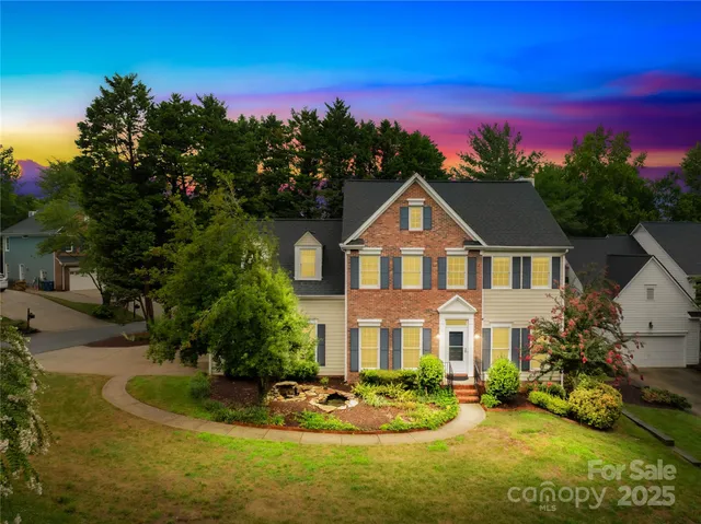 a front view of a house with a yard table and chairs