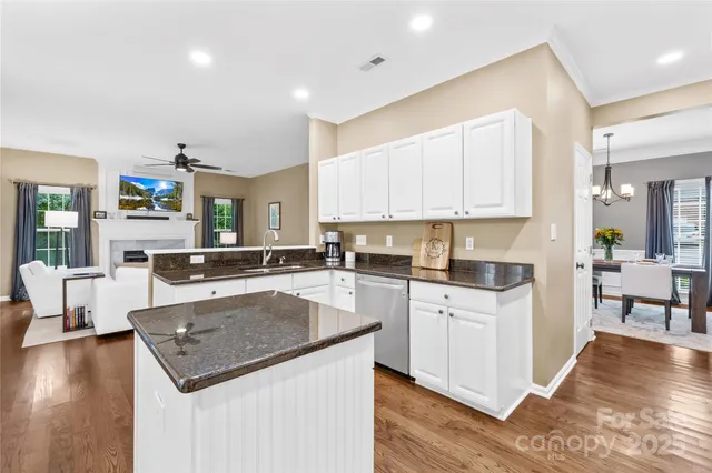 a kitchen with a stove a sink and a refrigerator