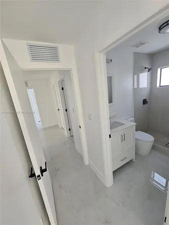 wooden floor with white walls