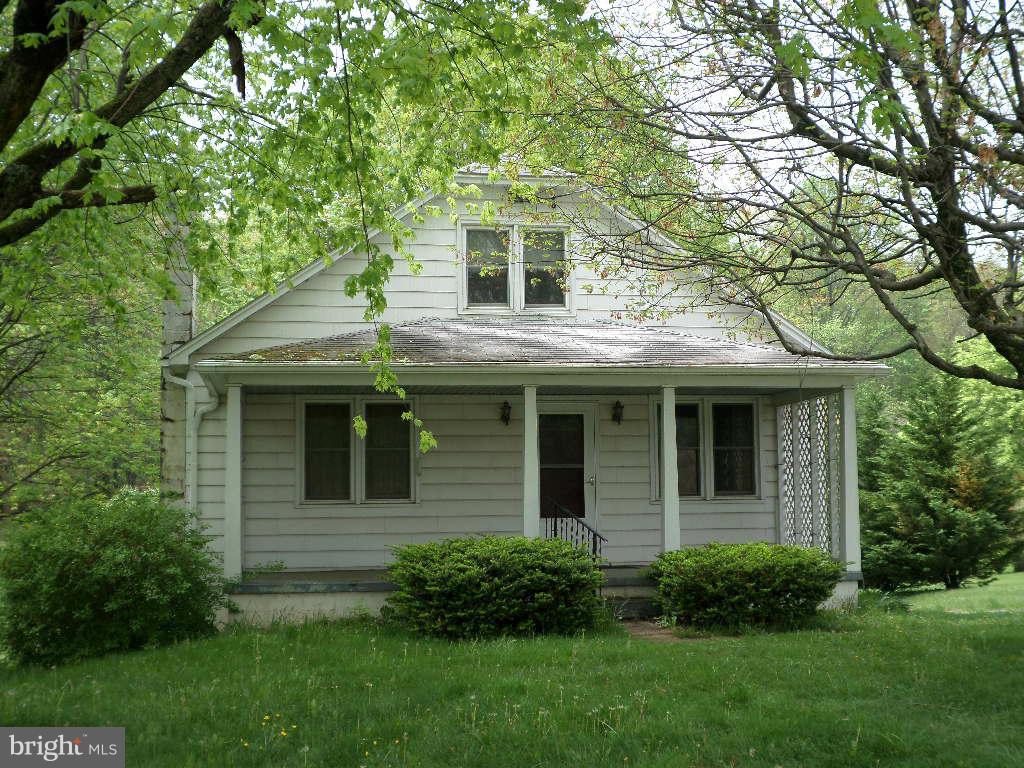 2360 Sandymount Road Finksburg, MD 21048 - Photo 1 of 5 a front view of a house with a garden