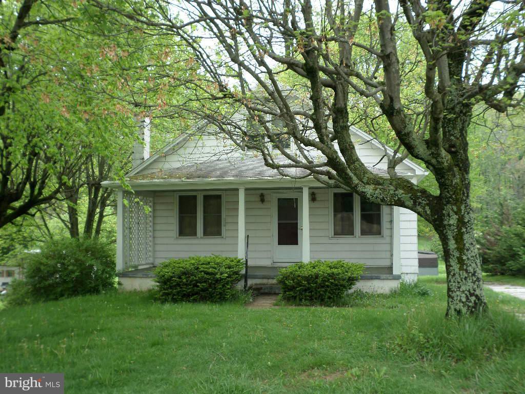 2360 Sandymount Road Finksburg, MD 21048 - Photo 5 of 5 a front view of a house with a garden