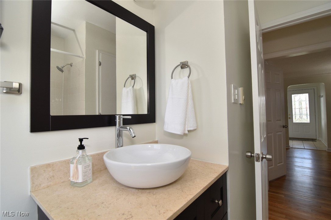 1575 Lander Road Cleveland, OH 44124 - Photo 23 of 49 Bathroom featuring vanity, wood finished floors, and a shower