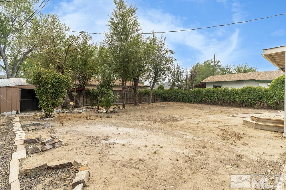 3408 Rauscher Drive Reno, NV 89503 - Photo 14 of 16 a view of a backyard with large trees