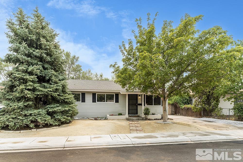 3408 Rauscher Drive Reno, NV 89503 - Photo 16 of 16 a house with trees in the background