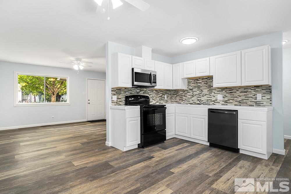 3408 Rauscher Drive Reno, NV 89503 - Photo 5 of 16 a kitchen with granite countertop a stove top oven and cabinets