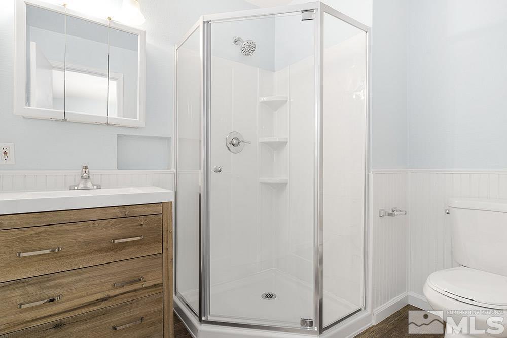 3408 Rauscher Drive Reno, NV 89503 - Photo 7 of 16 a bathroom with a shower a sink and a toilet