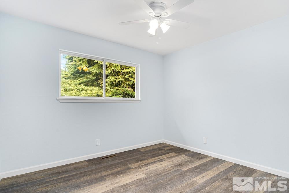 3408 Rauscher Drive Reno, NV 89503 - Photo 8 of 16 an empty room with wooden floor and windows