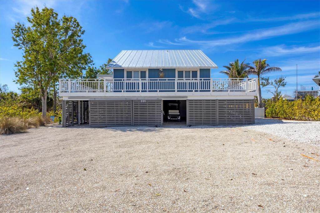 331 Bocilla Drive Boca Grande, FL 33921 - Photo 7 of 34 a view of house with outdoor space and yard