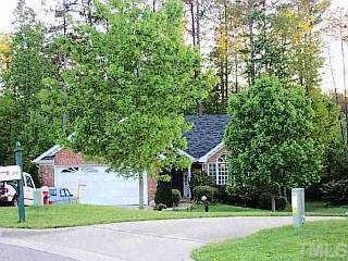 812 Babock Court Raleigh, NC 27609 - Photo 1 of 1 a front view of a house with a yard and a tree