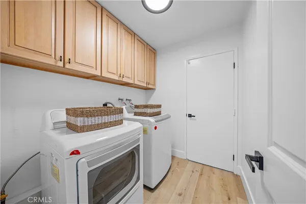 a kitchen with granite countertop a sink and refrigerator