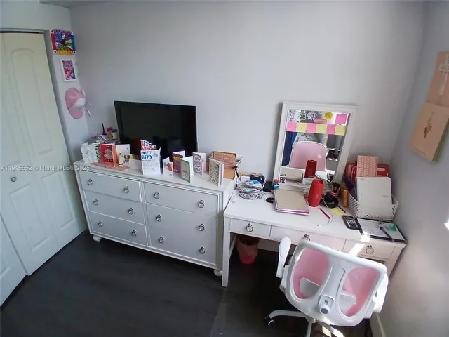 a bedroom with bed and a window