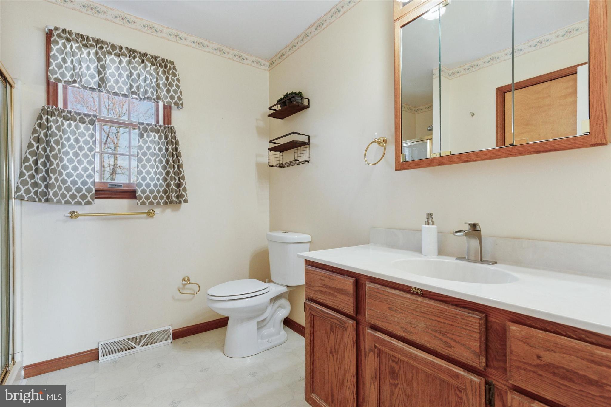 1481 Independence Way Hatfield, PA 19440 - Photo 19 of 35 a bathroom with a sink a toilet and mirror